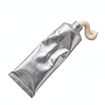 Shiny metallic tube with white paste extruding from the nozzle on white background