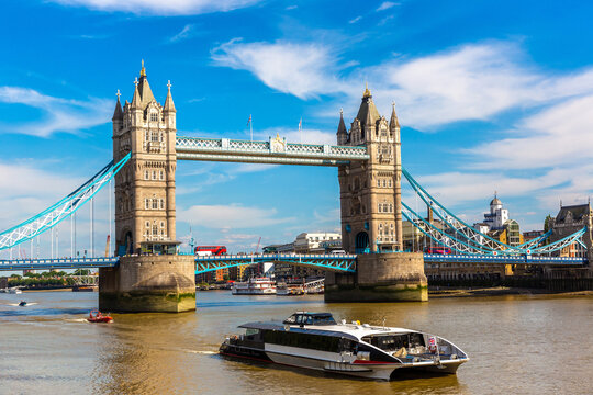 Tower Bridge with boat on River Thames in London, England, UK