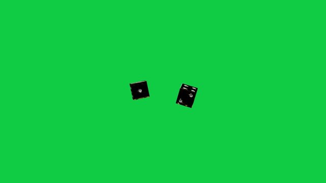 On start two dark dice rotating, tumbling, drifting and revealing gold glow on transparent backdrop