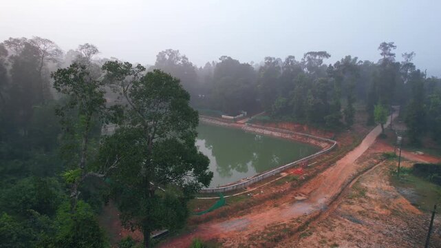 Madaga, Pond, Forest water pond, drone View
A sluice, floodgate, or canal, drain outlet used to let water flow out of a tank or reservoir.