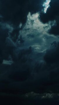 Dark ominous storm clouds with a break of light in the center timelapse, time lapse