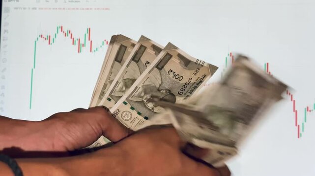 Close-up of a hand holding multiple Indian ₹500 currency notes, representing personal finance, cash savings, budgeting, investment, banking, and financial transactions in India.