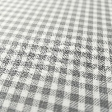 Close up view of gray and white checkered fabric texture.