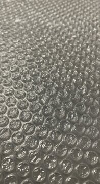 Close up view of metallic bubble wrap texture surface.