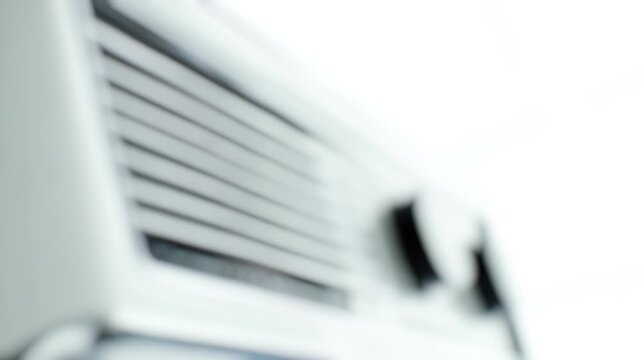 Close-up shot of an air conditioner's interior components on a white background