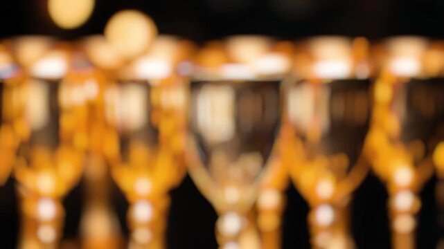 A collection of wine glasses arranged on a table, perfect for use in still life graphy or as a background element