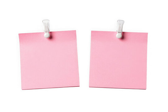 Two pink sticky notes hanging from white clips for reminders or ads.