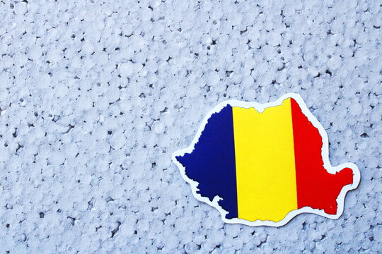 Romania Map with National Flag Symbol on Blue Textured Background with Copy Space