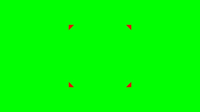 Four Red Corner Marks on a Vibrant Green Screen Background for Chroma Keying.