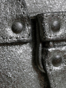 Industrial metal texture. Rough overlapping plates with rivets. Durable construction composition for machinery design  