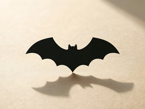 Set of simple matte black paper bat silhouettes with clean spacing