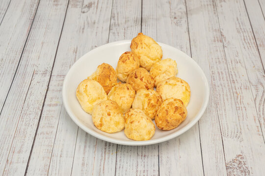 Baked Argentine Cheese Bread Chipas Piled on White Plate