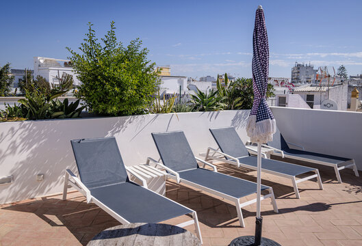 Row of loungers on a rooftop terrace, Olh&atilde;o, Algarve, Portugal