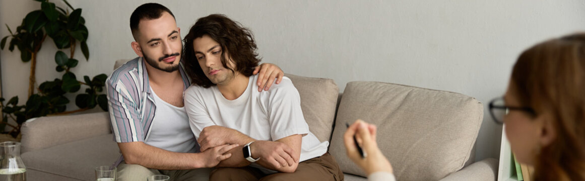 Loving couple shares feelings during therapy session with caring psychologist