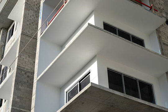 Modern building balconies under construction with concrete architecture