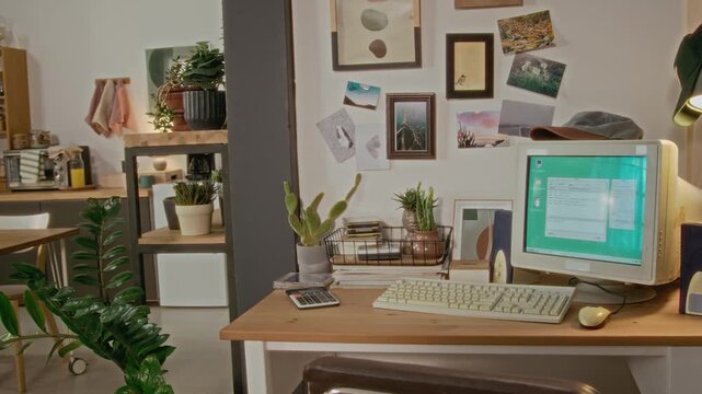 Retro computer setup with CRT monitor and vintage keyboard sitting on wooden desk, camera panning slowly. Footage is perfect for nostalgic technology commercials or history of computing videos