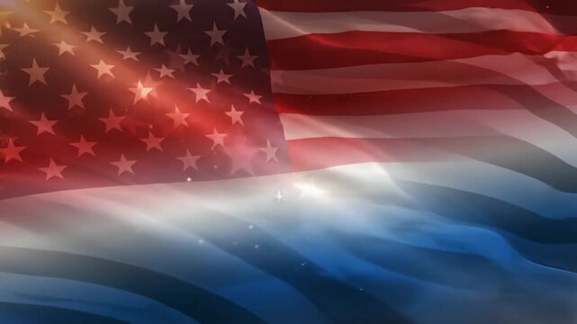 Waving fabric with stars and stripes pattern in red, white and blue