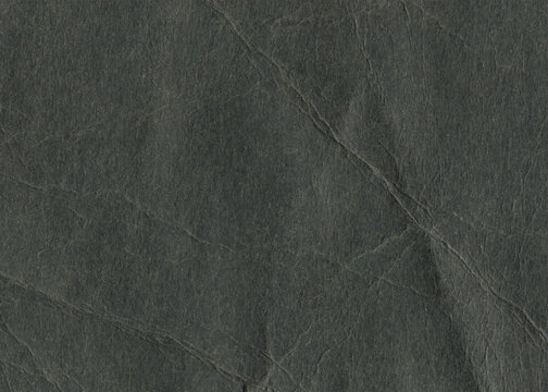 Crumpled black thick paper background. Wrinkled paper frame canvas for design.