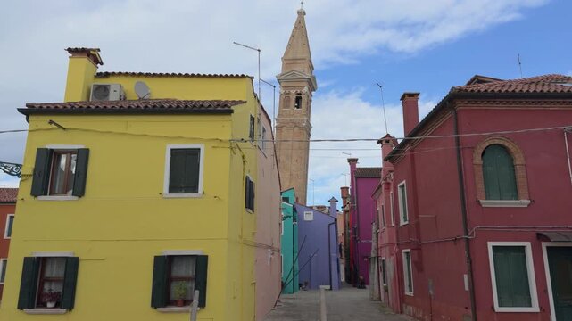 Colorful Burano Street Leading Toward Historic Church Tower