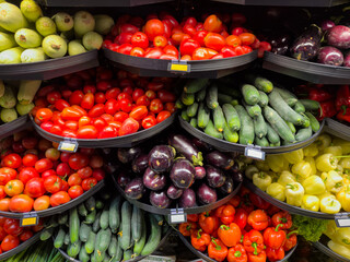 Colorful fresh vegetables arranged in abundant supermarket produce display