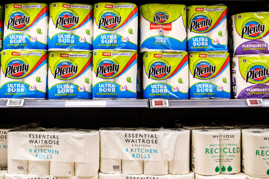 A Close-Up Shot Of A Supermarket Shelf Display Inside Waitrose Featuring Packets Of Branded Plenty Kitchen Rolls Alongside Essential Waitrose Kitchen Towels