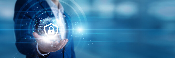 Security analyst holding a handheld device monitoring Cybersecurity threats on corporate networks. IT professional blocking malware attacks and defending sensitive digital infrastructure. © FutureLogic Studio