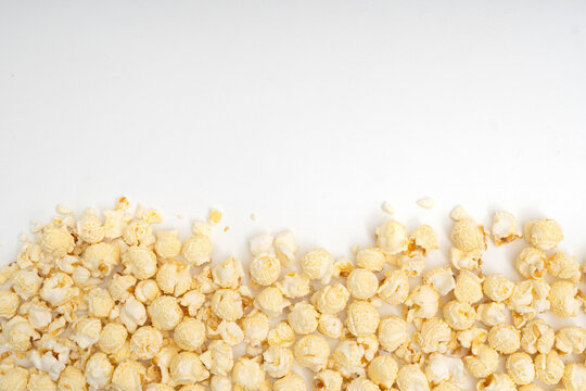 Top view of popcorn border at the bottom with copy space on white background