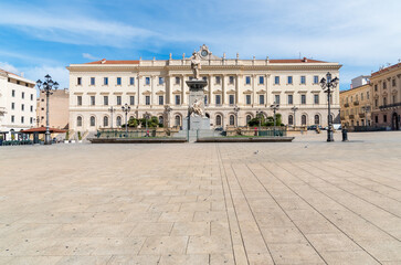 Obraz premium Piazza d'Italia, the main square in Sassari, Sardinia, Italy, featuring the grand Provincial Palace and the monument to King Vittorio Emanuele II.