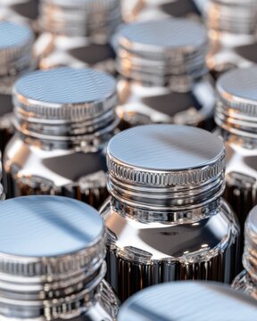Macro close up of metallic bottle caps on assembly line for packaging design and industrial product marketing