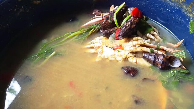 Traditional Guatemalan seafood soup dish prepared with freshwater snails Pachychilus known as jutes and blue crab Callinectes sapidus known as jaiba azul