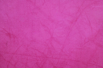 Fototapeta premium Bright fuchsia pink textured surface with subtle variations and soft feel
