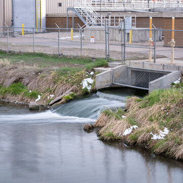 Processed and cleaned sewage flowing out from water reclamation facility to a river