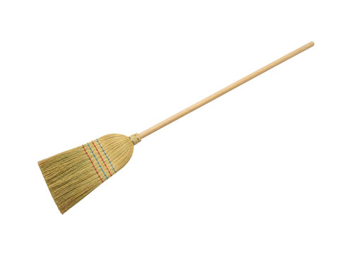 Traditional straw broom with a long wooden handle for cleaning floors