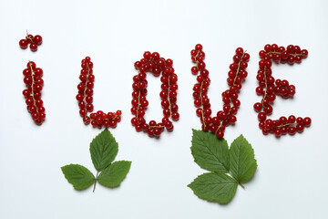 Redcurrant berries with green leaves on a white background. © Pixora ST 