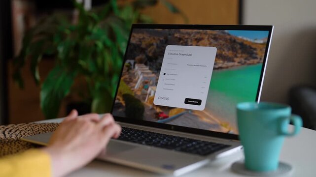 Woman using laptop to book hotel room reservation online.