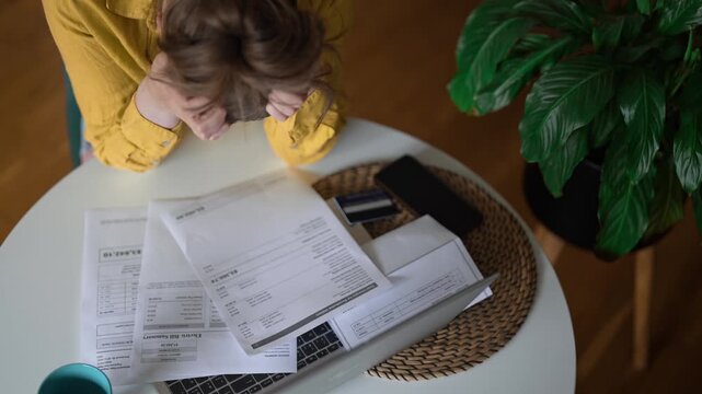 Stressed woman having financial problems with paying bills.