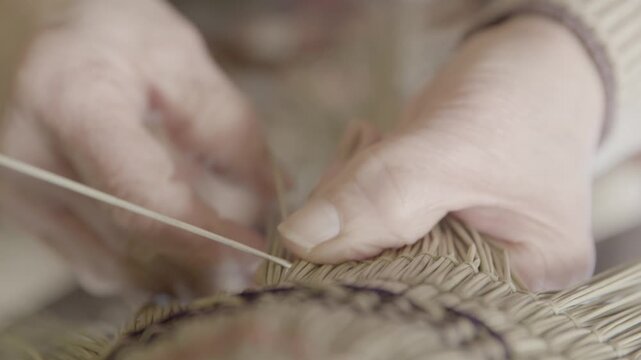 Closeup of Hands Weaving Traditional Bon Odori Hat in Ugo Town Akita P