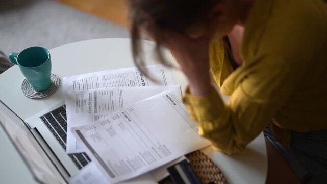 Stressed woman having financial problems with paying bills.