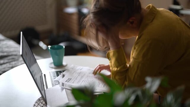 Stressed woman having financial problems with paying bills.