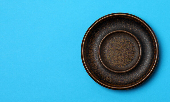 Top view of empty round plate on colorful background,Empty dish on napkin with space for your design.
