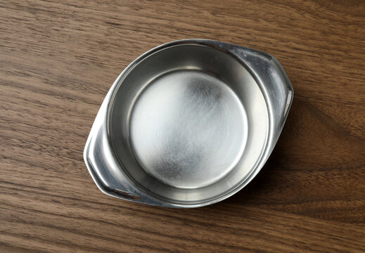Top view of empty round plate on colorful background,Empty dish on napkin with space for your design.
