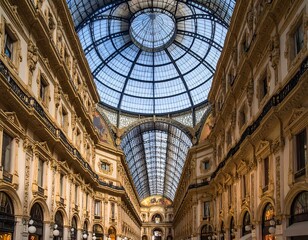 Obraz premium Ornate architectural interior featuring a high glass dome, intricate detailing, and symmetrical composition. Sunlight streams in