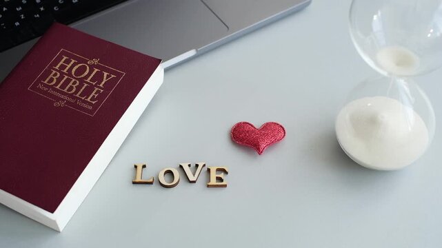 Learn about love using the Bible and a timer on a table in a room