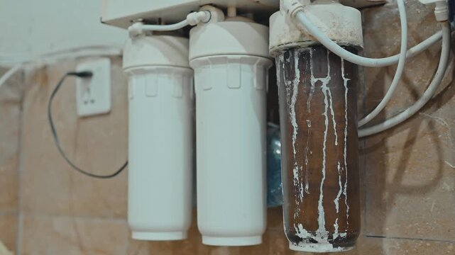 Close Up of Dirty Water Purifier Filter Cartridge with Sediment Buildup