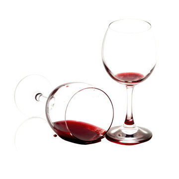 Red wine glass tipped over spilling red liquid isolated on transparent background isolated on a transparent background