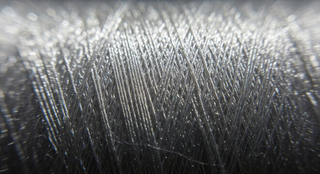 Extreme Close-up of Metallic Silver Thread Texture