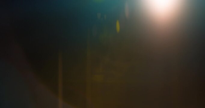 Anamorphic wide lens flare burst in slow motion, isolated on black background. Cinematic light streaks, ideal for VFX compositing, overlays, sci-fi transitions and film effects.