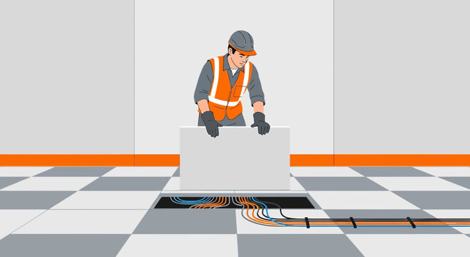 Technician installing cable in raised floor, network wiring, IT infrastructure