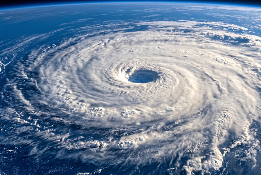 HDR photography of a massive terrifying hurricane and perfect eye seen from a high altitude