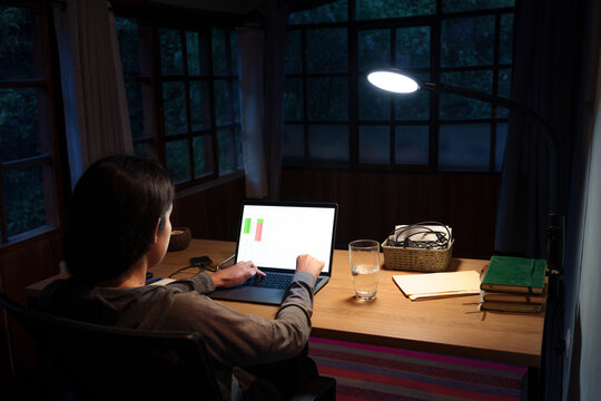 Woman Working Late on Laptop